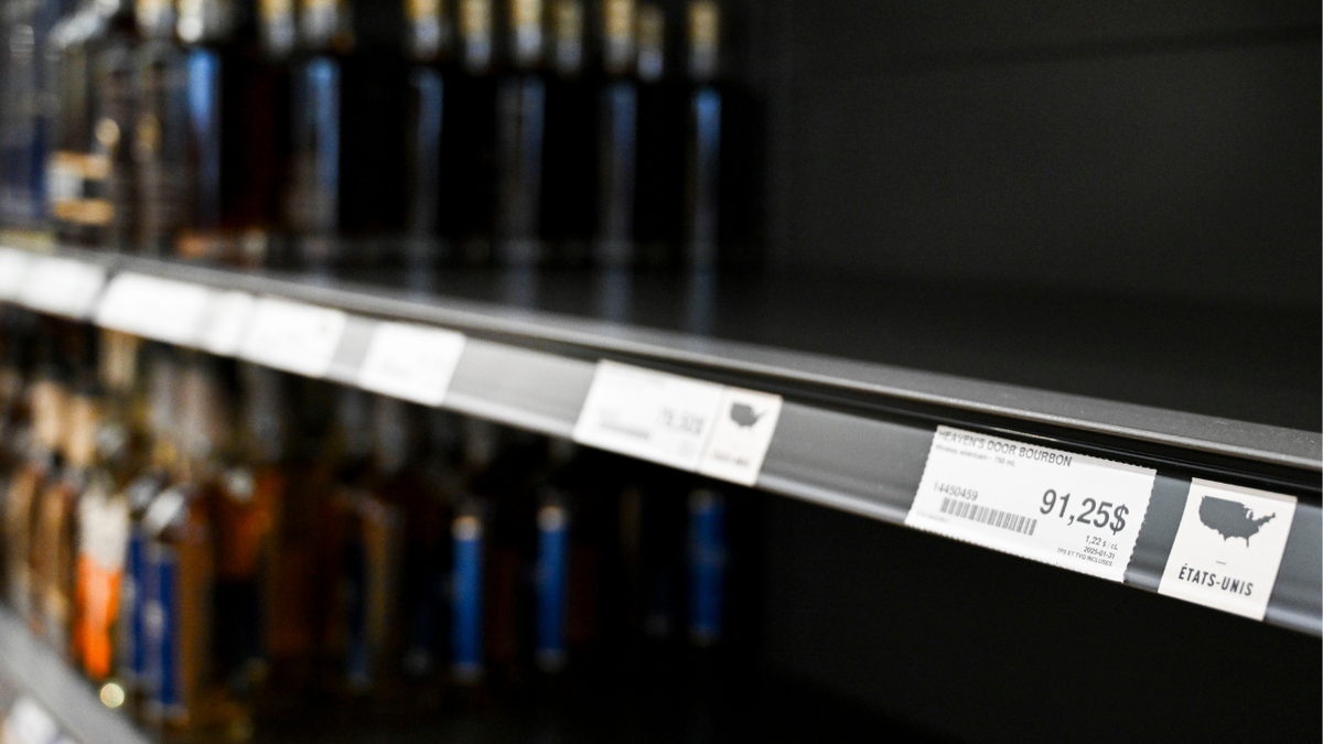 A price sticker for Heaven's Door bourbon near empty space on a shelf where American-made liquor had been at the Societe Des Alcools Du Quebec (SAQ) store in Montreal, Quebec, Canada, on Wednesday, March 5, 2025.