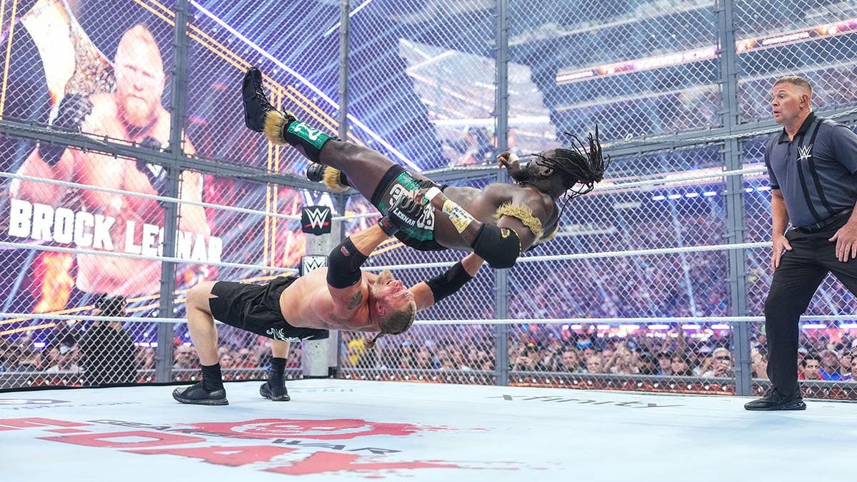 Brock Lesnar wrestles Oba Femi in a ring at U.S. Bank Stadium.