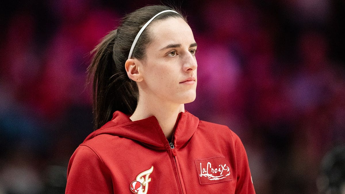 Caitlin Clark of the Indiana Fever warming up on basketball court.