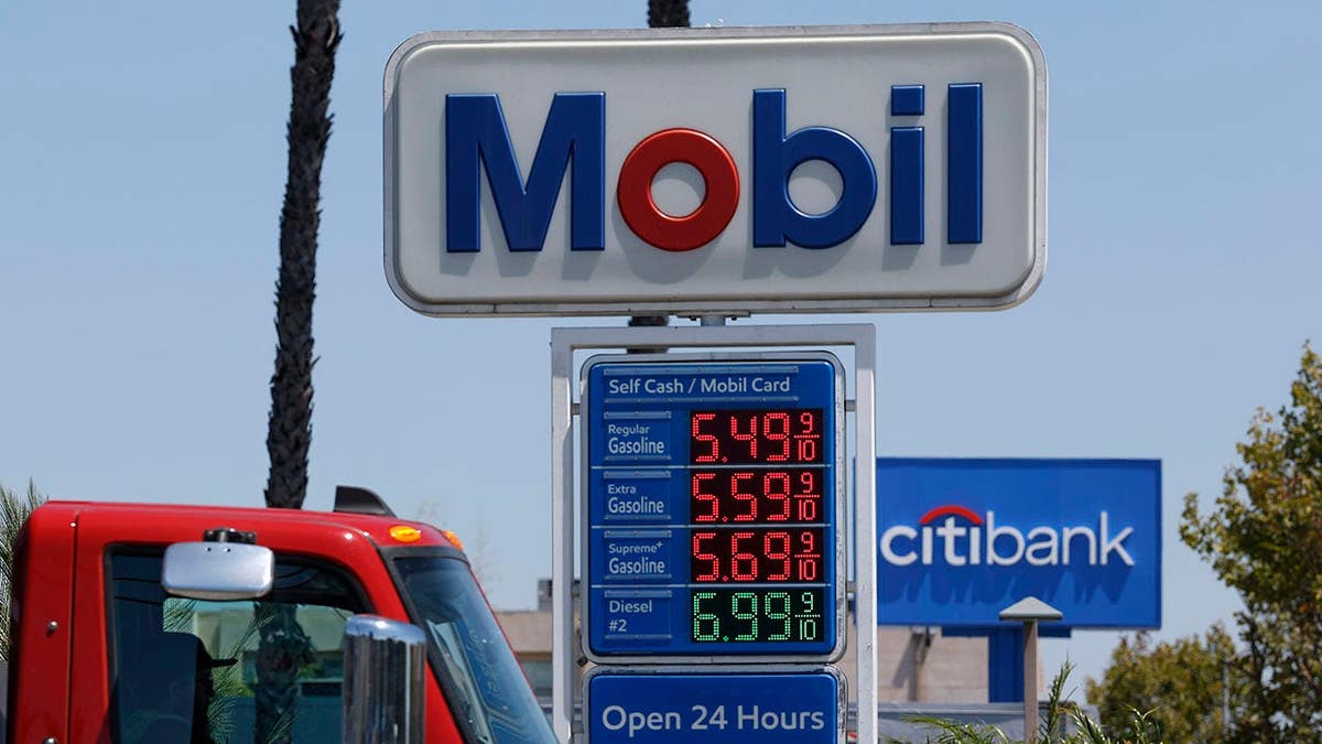 Gas prices displayed on a sign at a Mobil gas station in Los Angeles, California.