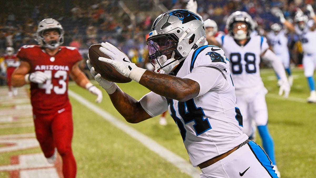 Anthony Tyus III runs toward the end zone