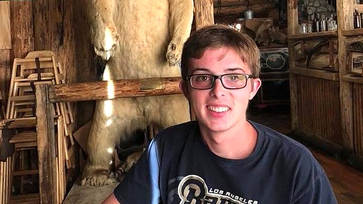 Christopher Hawley smiling inside an establishment.