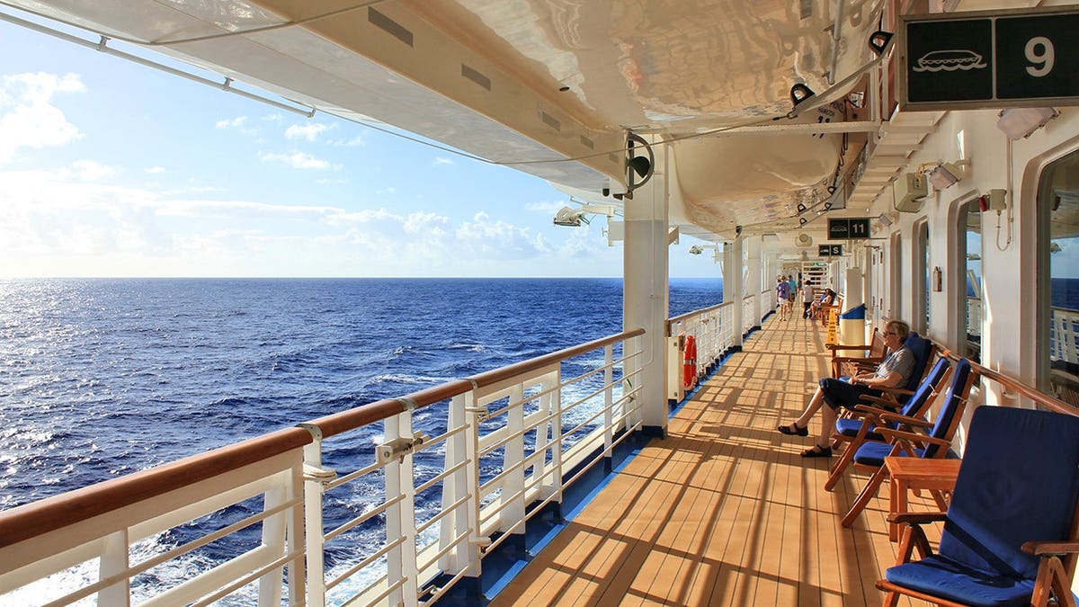 Crown Princess cruise ship sails on open deck at sea.