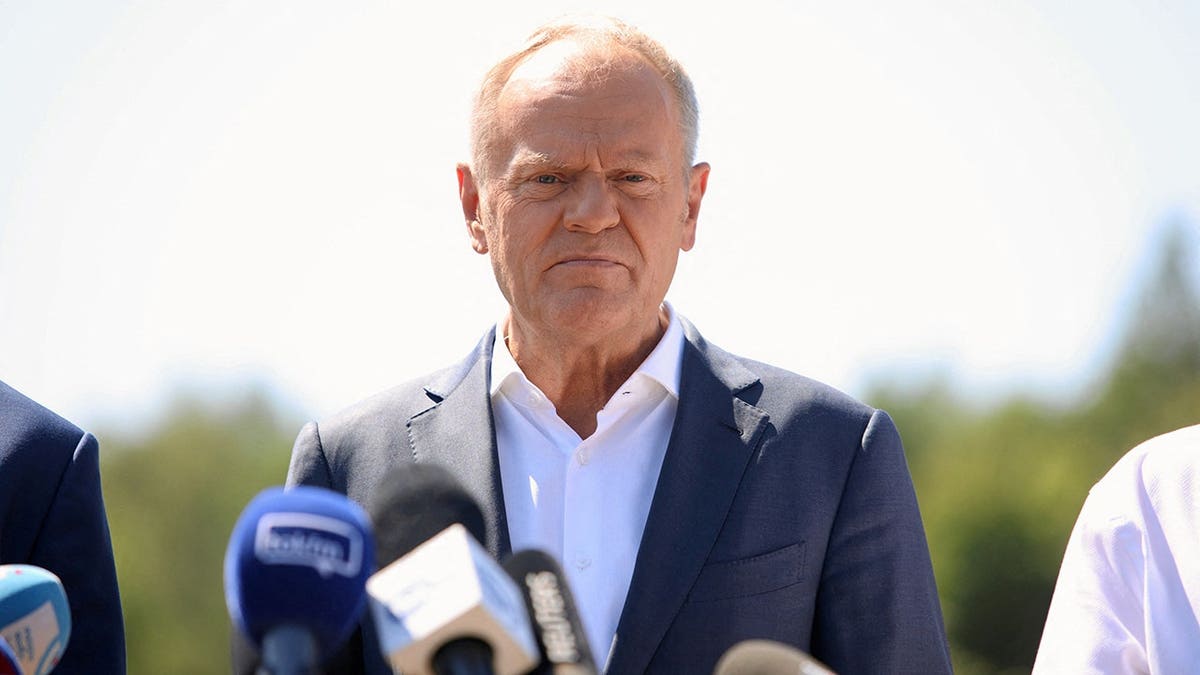 Donald Tusk speaks to media at a field site near Lublin, Poland.