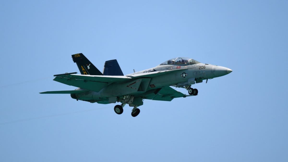 U.S. Air Force F-15 fighter jet flying against a clear blue sky