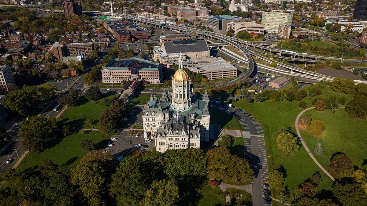 Aerial view of downtown Hartford, Connecticut, featuring the Connecticut State Capitol and surrounding city buildings
