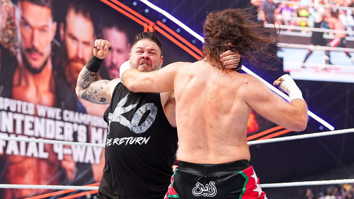 Kevin Owens and Sami Zayn wrestle during SummerSlam at U.S. Bank Stadium.