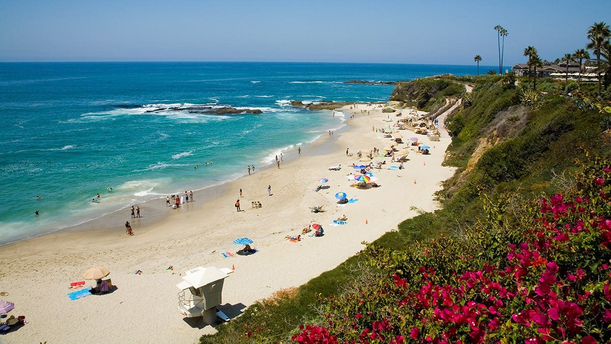 Panoramic view of Laguna Beach with turquoise ocean waves.