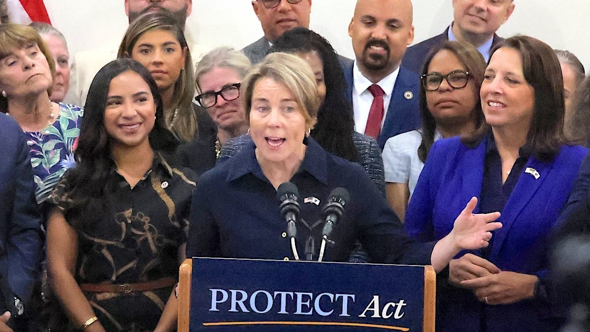 Governor Maura Healey speaks at a podium indoors.