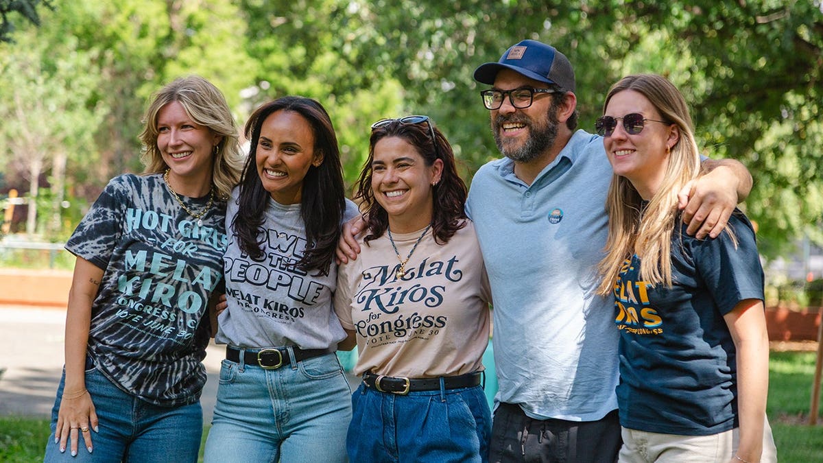 Melat Kiros poses with volunteers at a canvassing rally in La Raza Park.