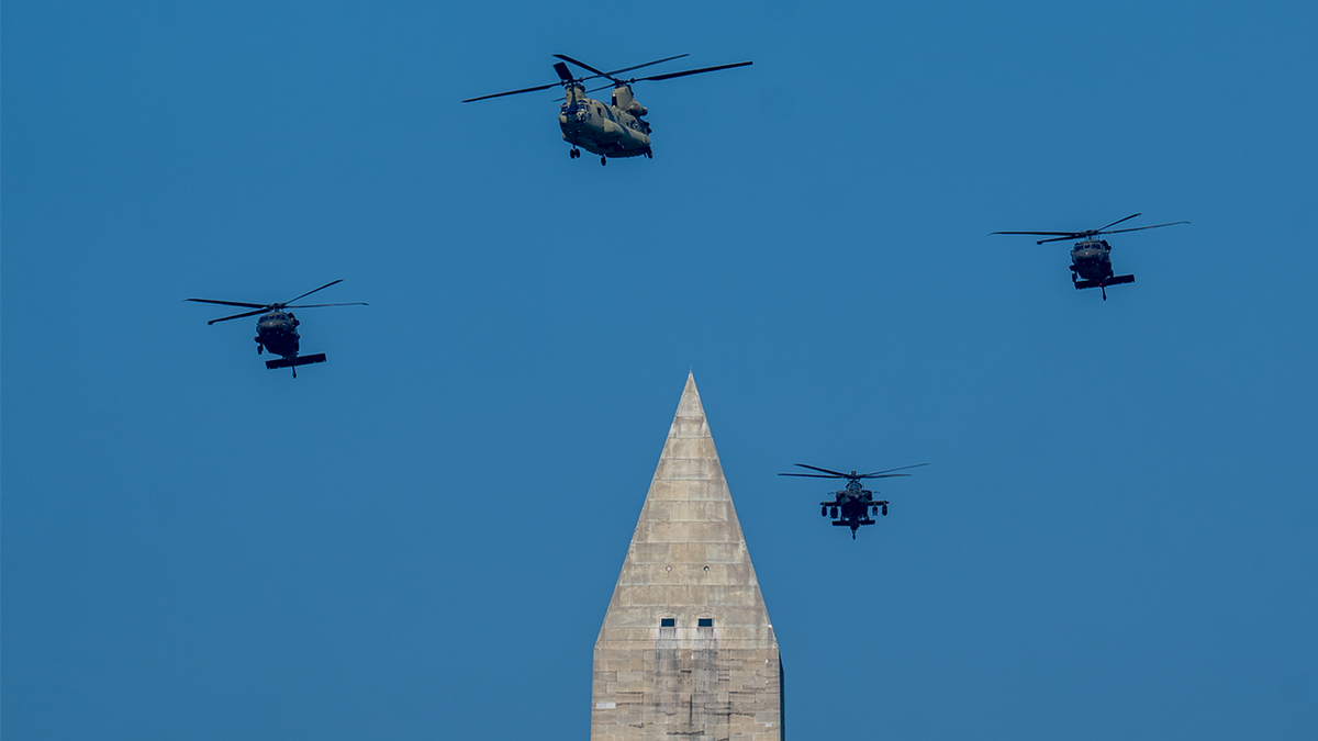 U.S. Army aircraft flying above the Washington Monument