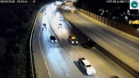 Vehicle narrowly avoids slamming into driver on side of Ohio highway, dramatic video shows