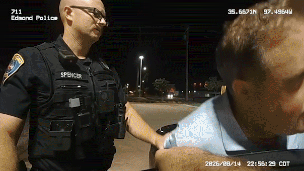 Edmond police officer takes Oklahoma Secretary of State Benjamin Lepak into custody outside a McDonald's.