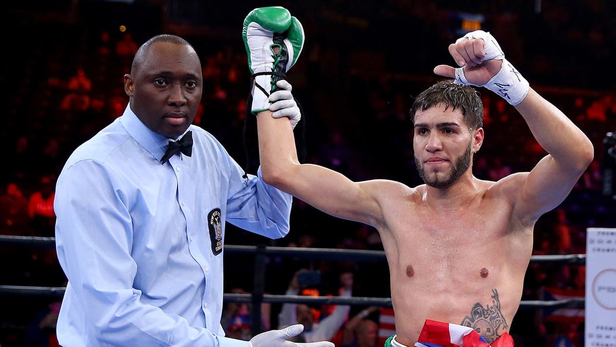 Prichard Colon celebrates his win over Daniel Calzada in the ring at Barclays Center.