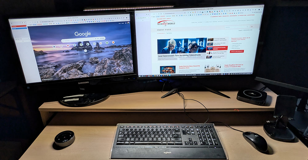 Quntis Glow monitor light bar spanning a dual-monitor setup.