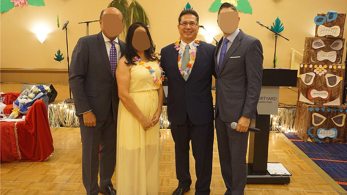 Former Baldwin Park Councilman Ricardo Pacheco poses with attendees at a community event