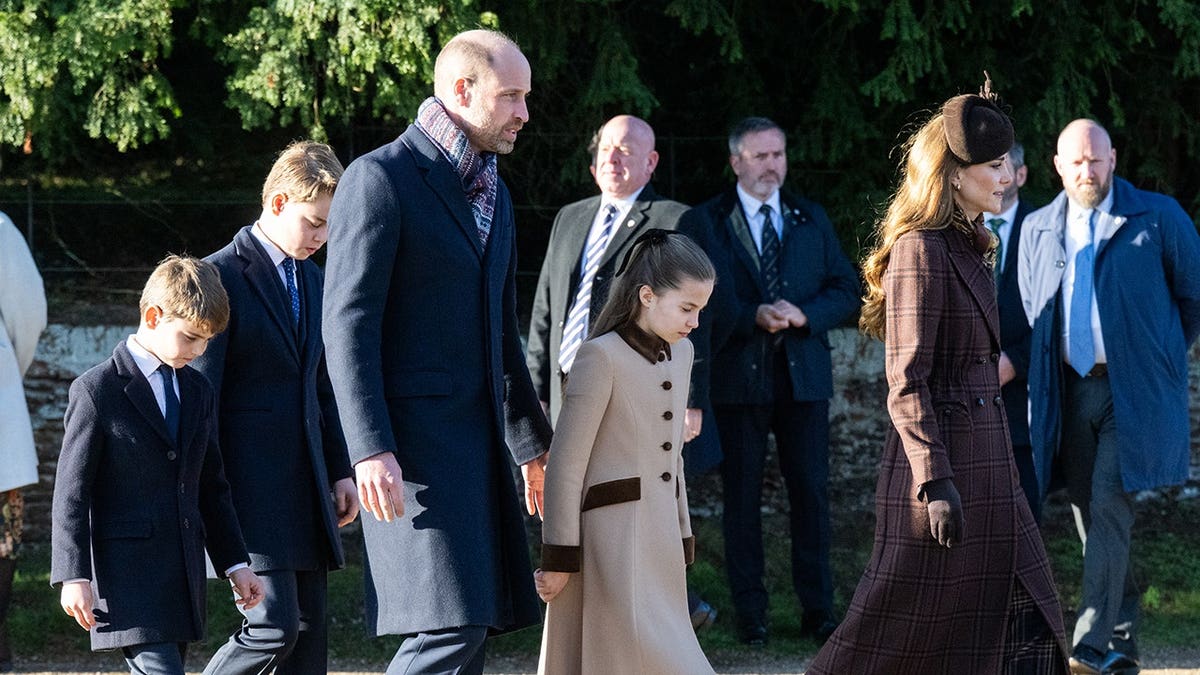 Prince William, Catherine, Prince George, Prince Louis and Princess Charlotte stand together outside a church.
