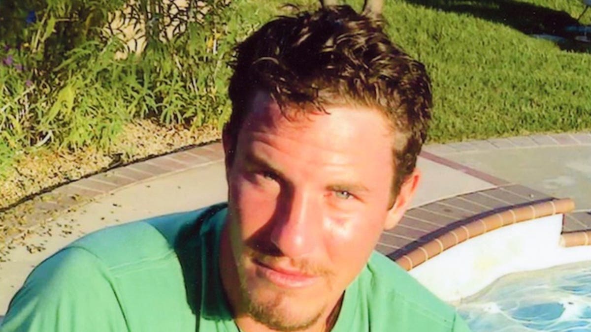 Sam Herr wearing a bright green shirt.