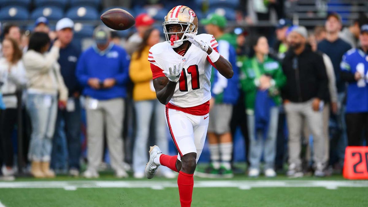 San Francisco 49ers wide receiver Brandon Aiyuk (11) catches the ball during warmups before the game against the Seattle Seahawks at Lumen Field on Oct. 10, 2024 in Seattle, Washington.
