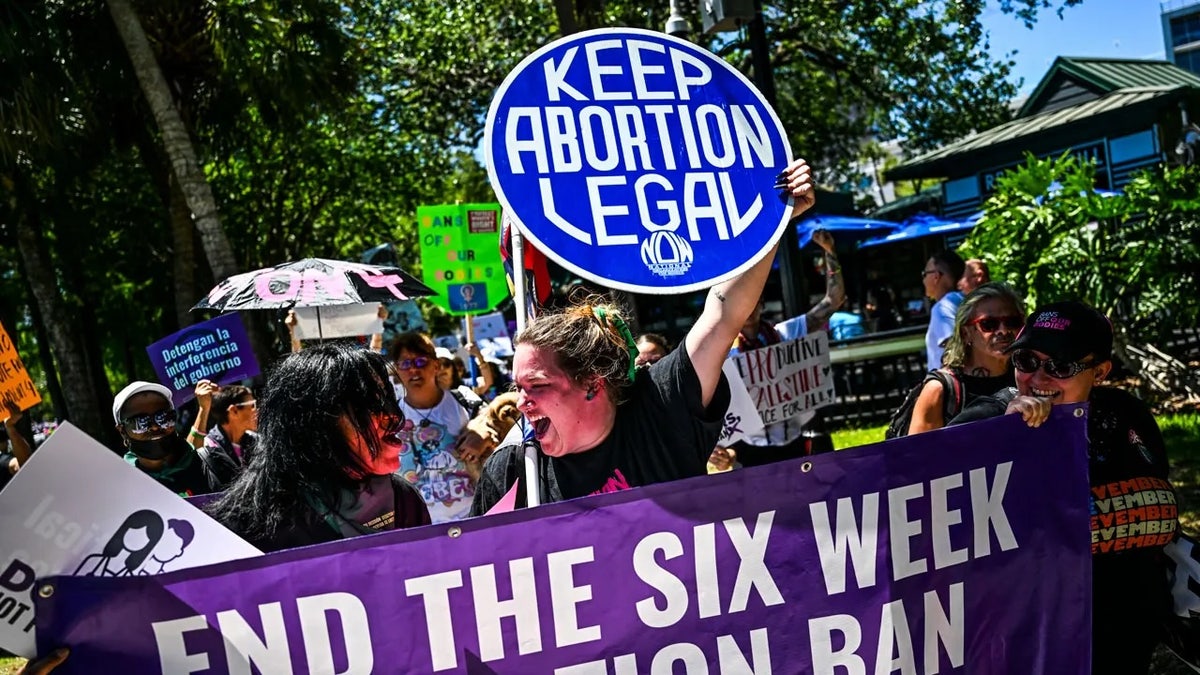 Protestors holding signs