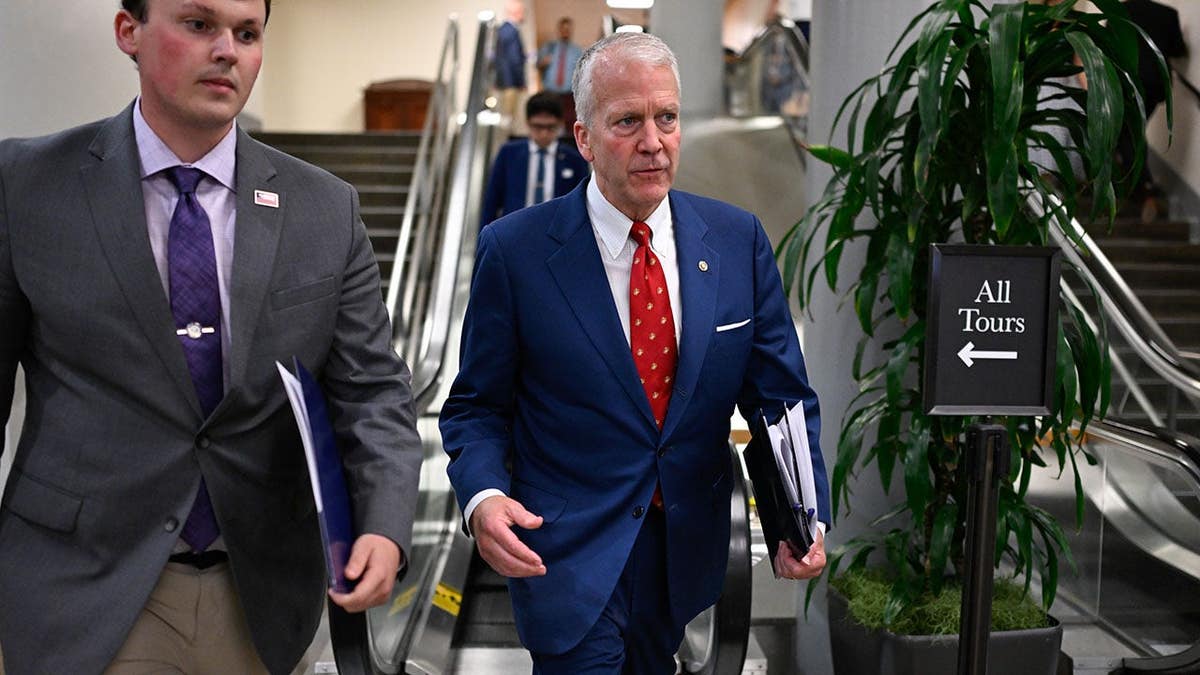 Senator Dan Sullivan standing in the Senate Subway of the US Capitol in Washington, D.C.