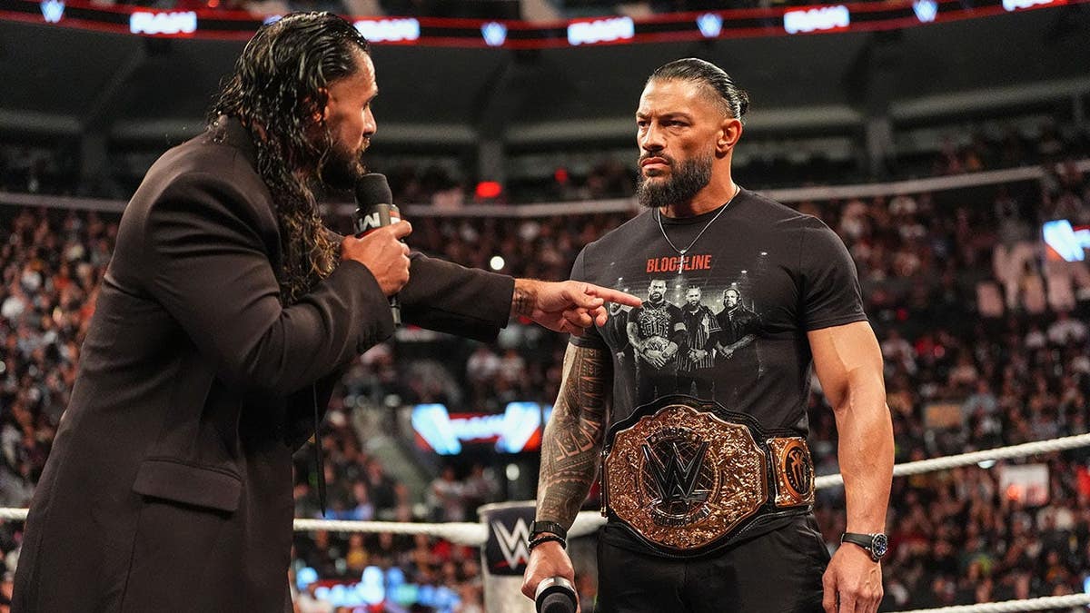 Seth Rollins and Roman Reigns speak during Monday Night RAW.