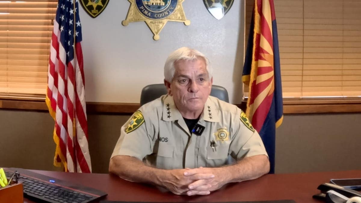 Sheriff Chris Nanos at his desk in uniform
