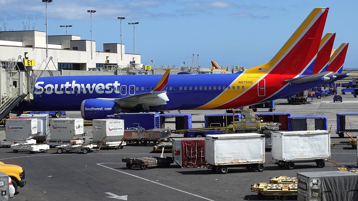 Three Southwest Airlines planes parked at ground gates at JFK airport
