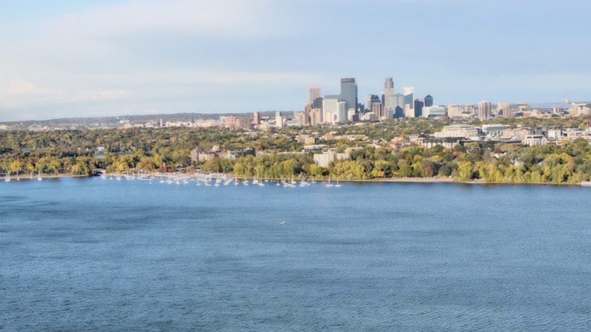 image shows lake with skyline in backdrop
