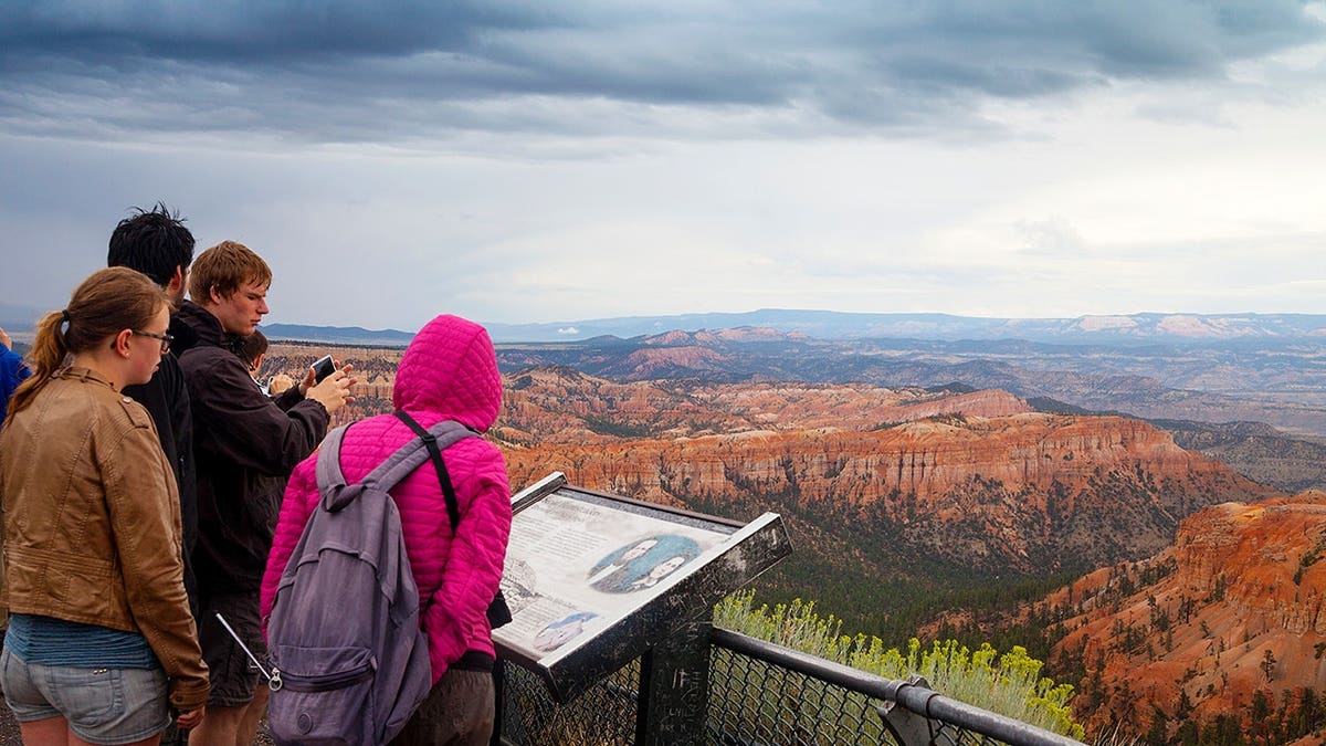 Tourist looking at the view in Bryce Canyon National Park, Utah.