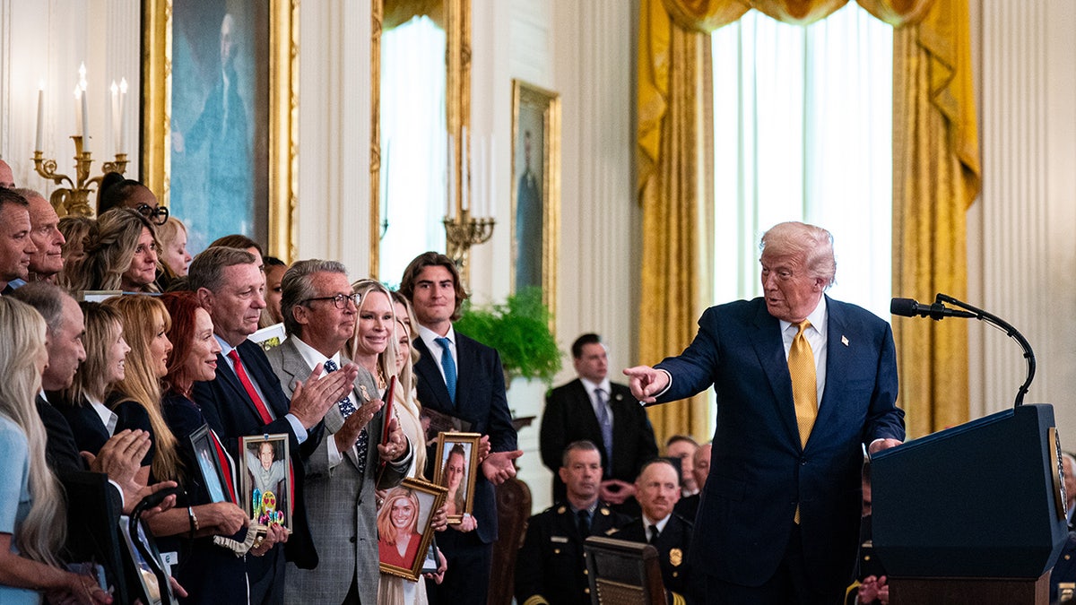 Trump talks to families of fentanyl victims during a bill signing ceremony