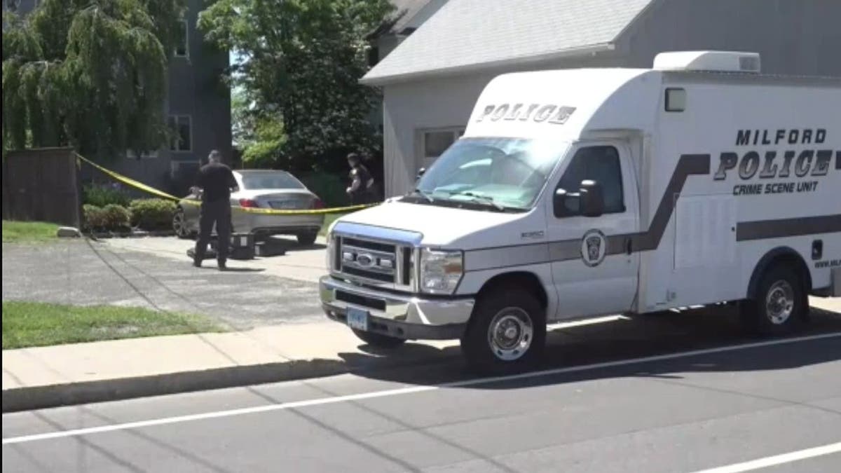 image shows police van with crime scene tape outside scene of alleged invasion