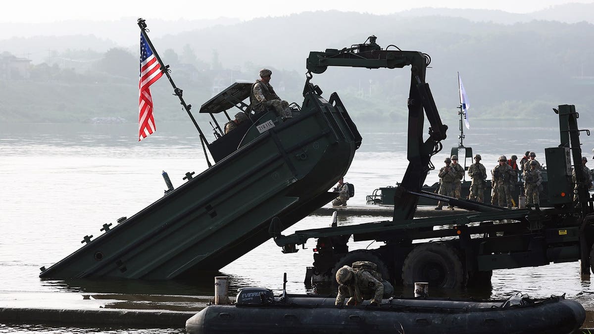 U.S. soldiers from the 2nd Infantry Division cross a river during the Ulchi Freedom Shield exercise.