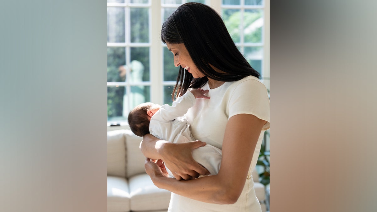 Usha Vance holding baby Alec.