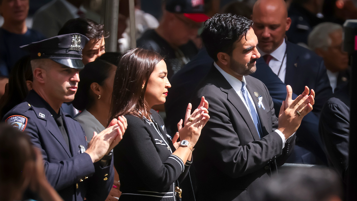 Representative Alexandria Ocasio Cortez, a Democrat from New York, center, and Zohran Mamdani, mayor of New York, center right, during the 25th anniversary commemoration ceremony at the National 9/11 Memorial and Museum in New York.