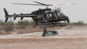 Arizona sheriff deploys helicopter to save 2 stranded in flooded car Arizona sheriff deploys helicopter to save 2 stranded in flooded car