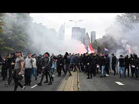 Dutch police clash with hundreds of far-right protesters at anti-immigration rally