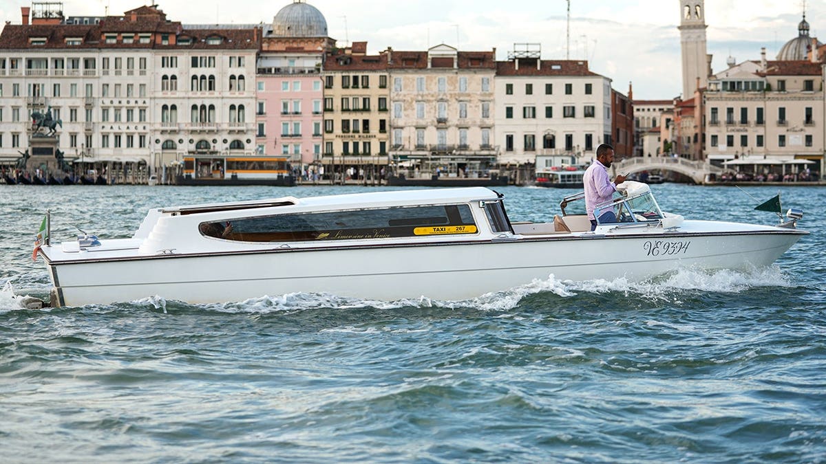 View of water taxi driving in Venice