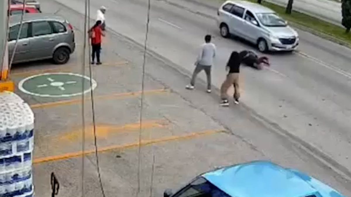 Luis Cruz saves a little girl from being hit by a mini van in Puebla, Mexico on Sept. 6, 2026.