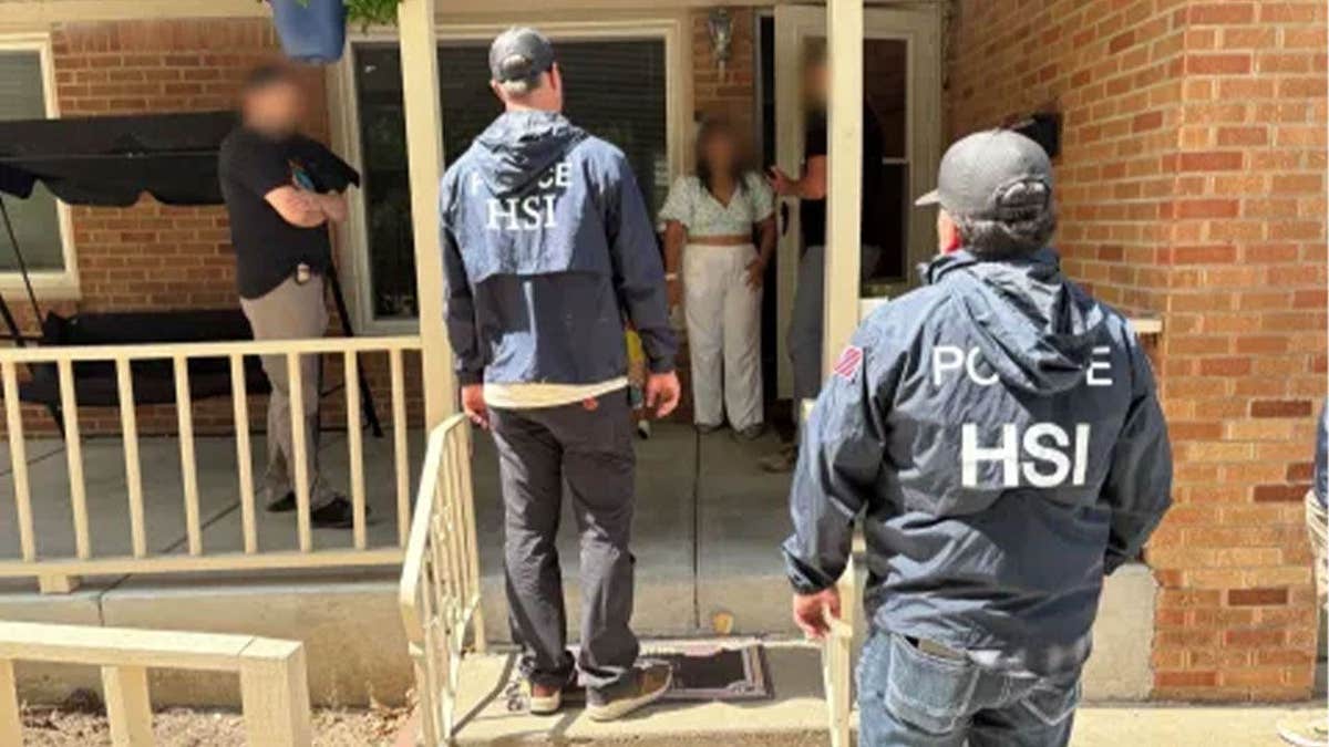 HSI agents approach a Wichita home while arresting Mariana Alexandra Dewey