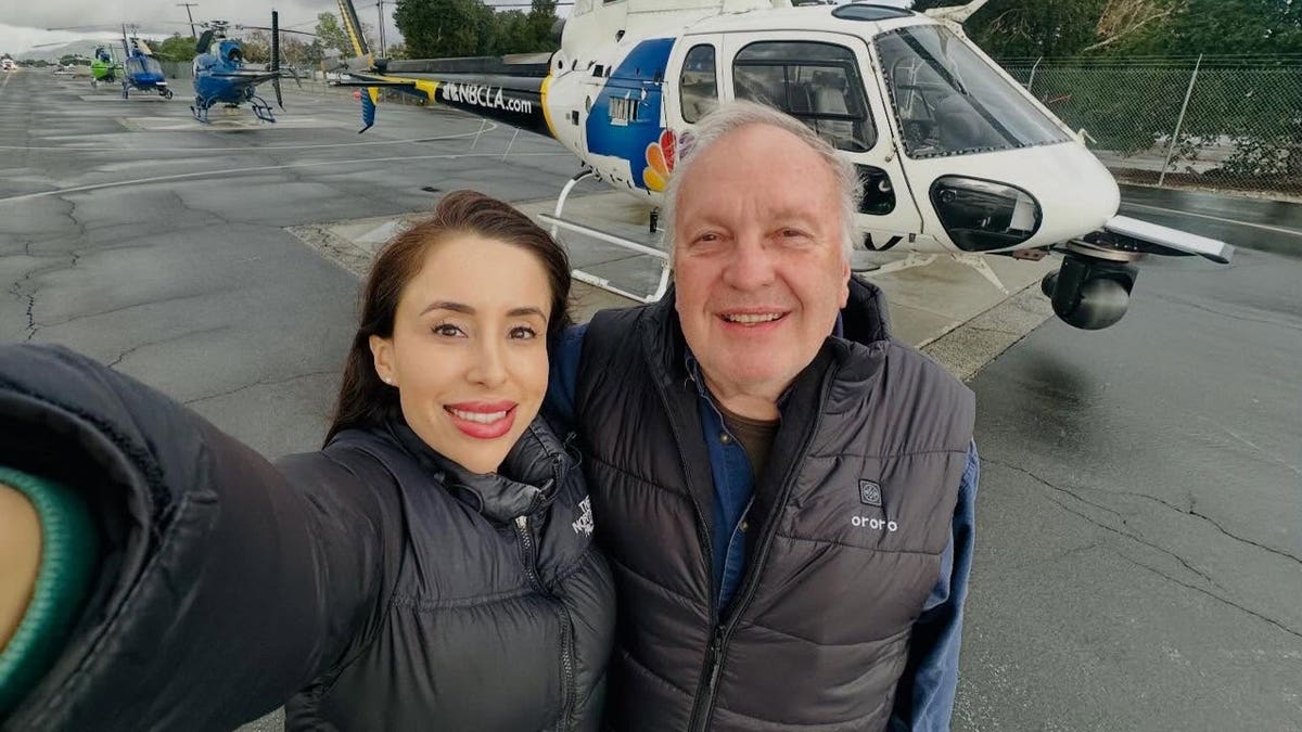 Eliana Moreno and George Marciniw pose together in front of NewsChopper4