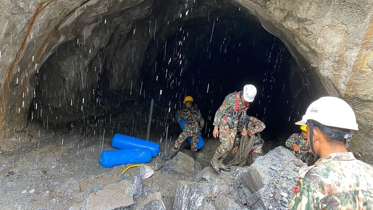 Nepal army soldiers work during a search and rescue operation at the entrance of a tunnel near the Hydropower Project sites, following deadly flash floods and mudslides, in Rasuwa district, Nepal, in this handout obtained by Reuters on September 2, 2026.