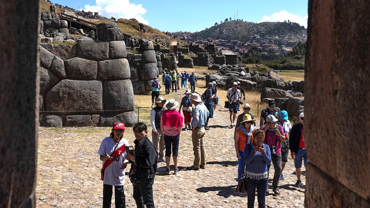 Tourists at archaeological site in Peru