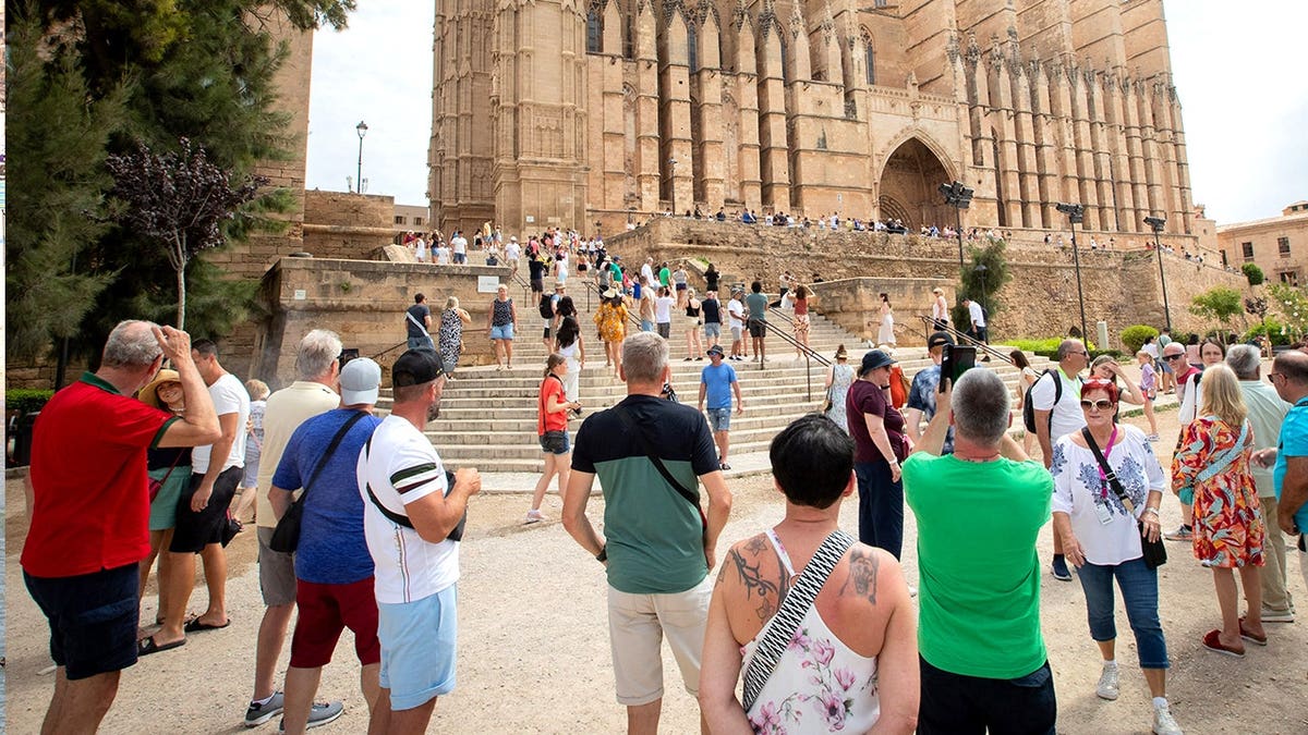 View of tourists near historic Mallorca buildings