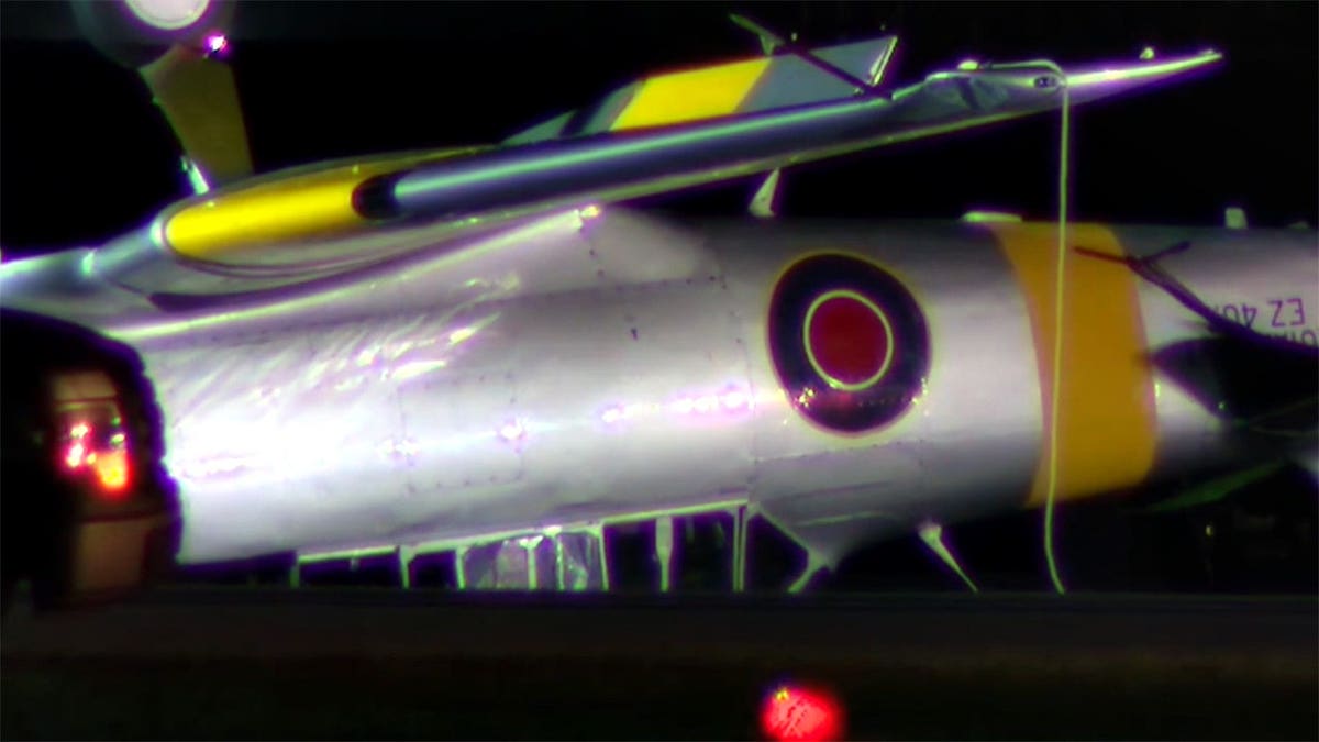 a closeup view of the side of the overturned aircraft