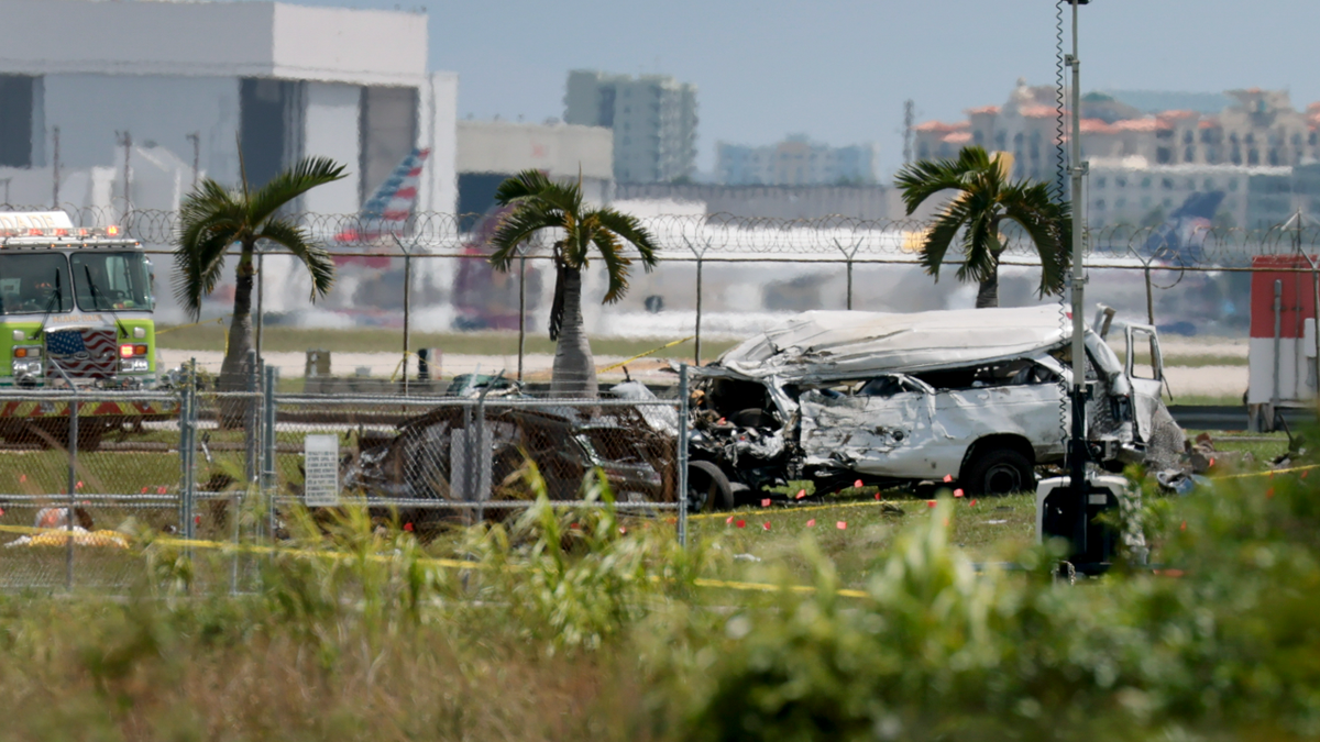 Damaged vehicles are seen at Miami International Airport