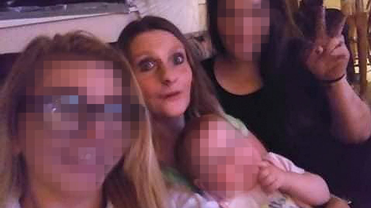 angela lipps with family in living room
