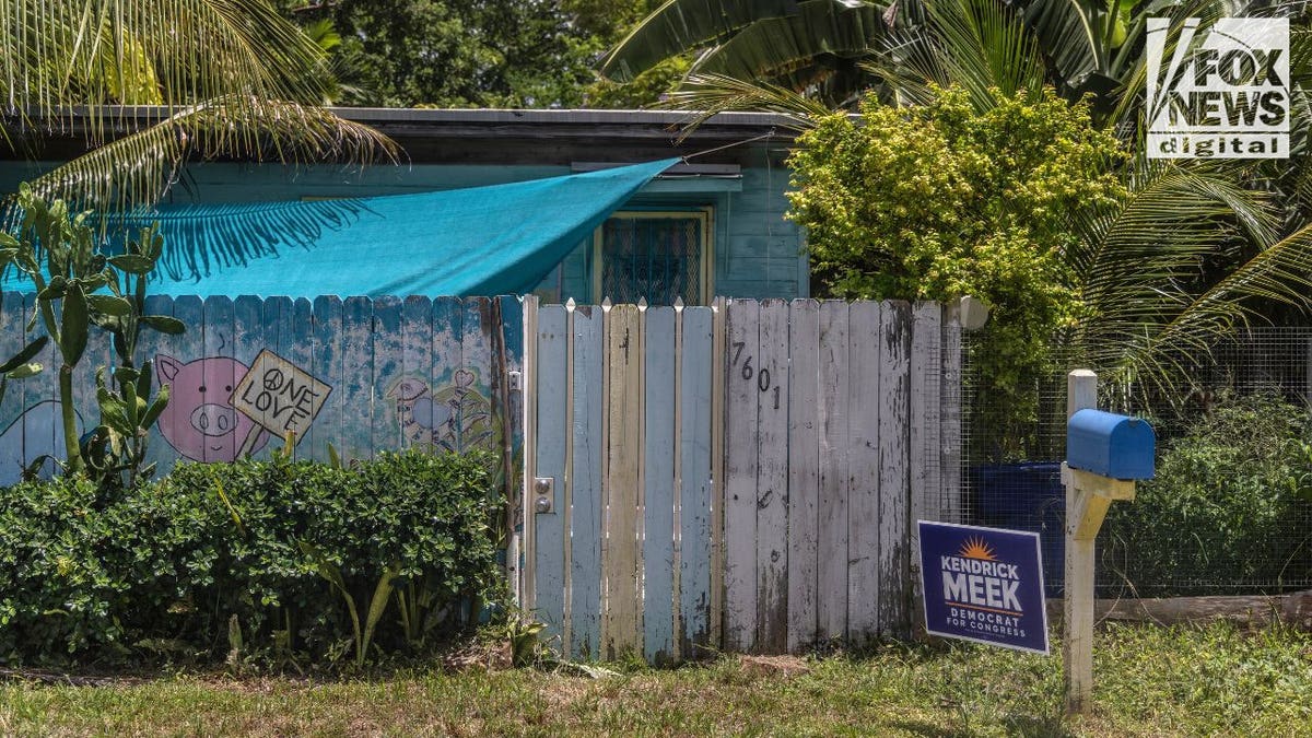 Miami property with street number visible on a weathered fence outside the home. Credit: