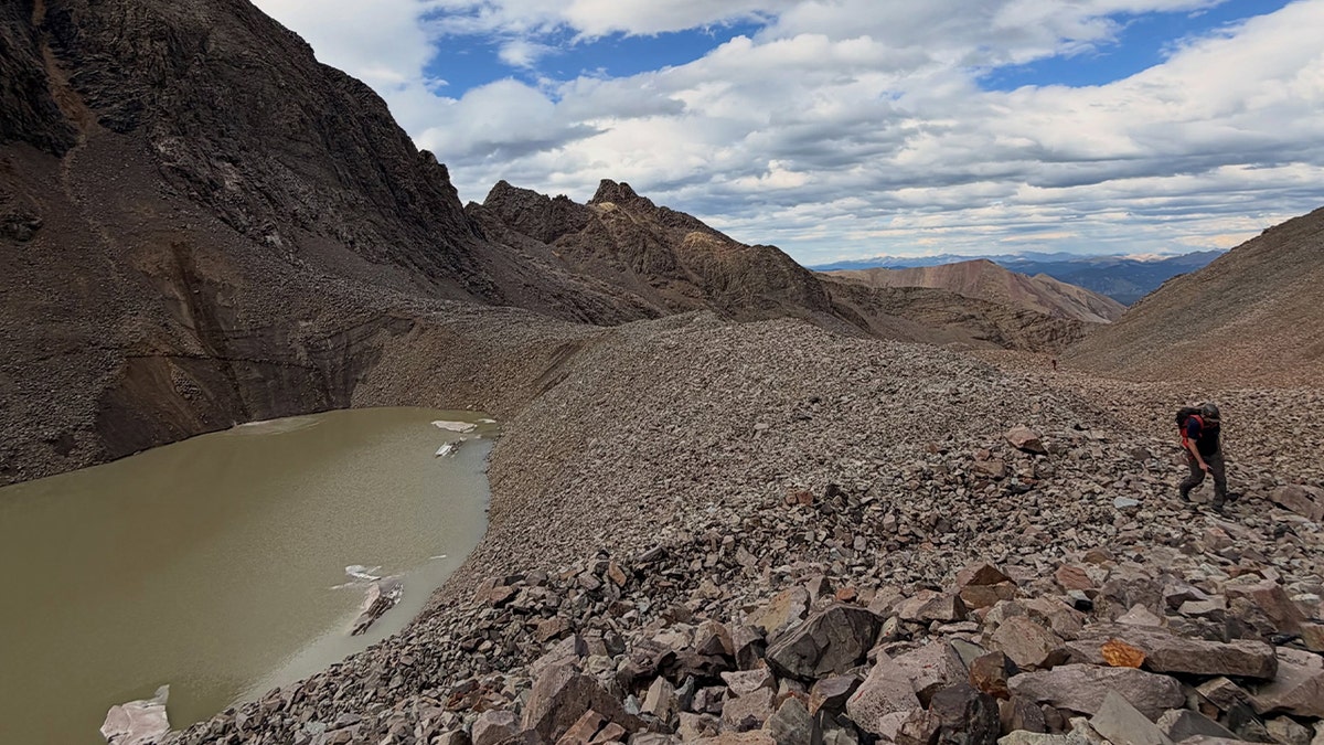 mountain range with nearby pond