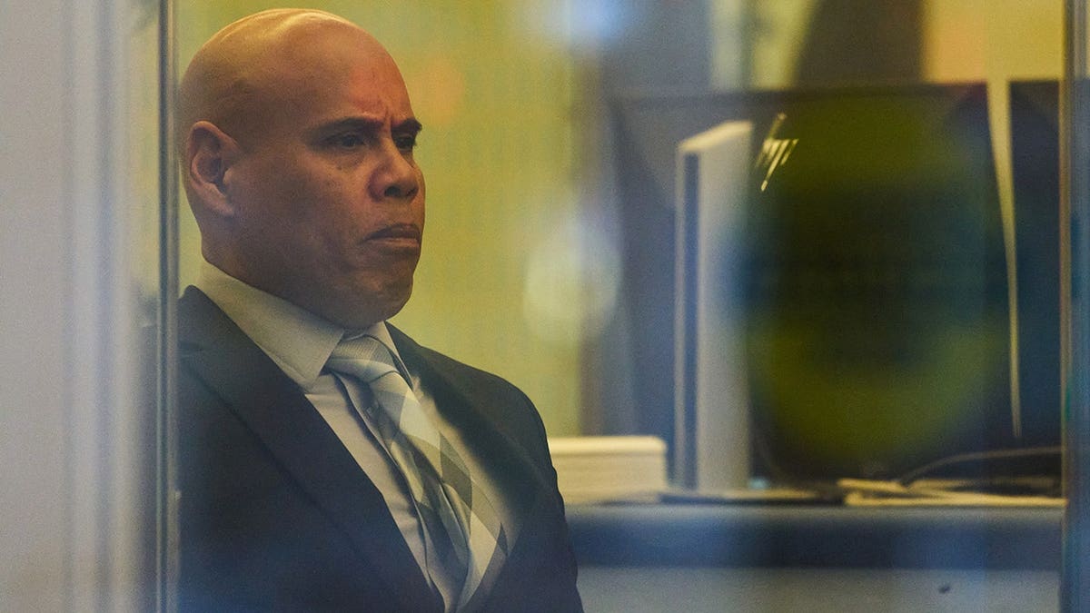 Christian Castro, an immigration officer, enters the Warren E. Burger Federal Building in St. Paul, Minn.